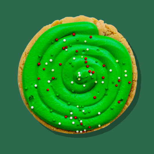 Under the Mistletoe Maxi cookie with green toffee apple cream cheese frosting and festive sprinkles.