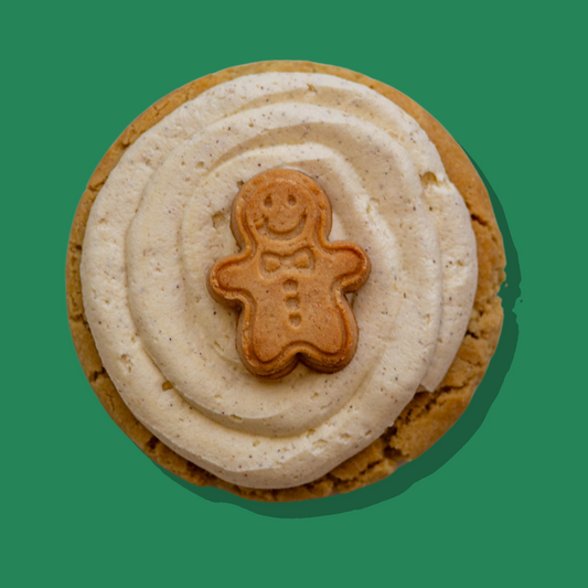 Lil' Gingy Maxi gingerbread cookie with white chocolate chips and spiced buttercream topped with gingerbread man.