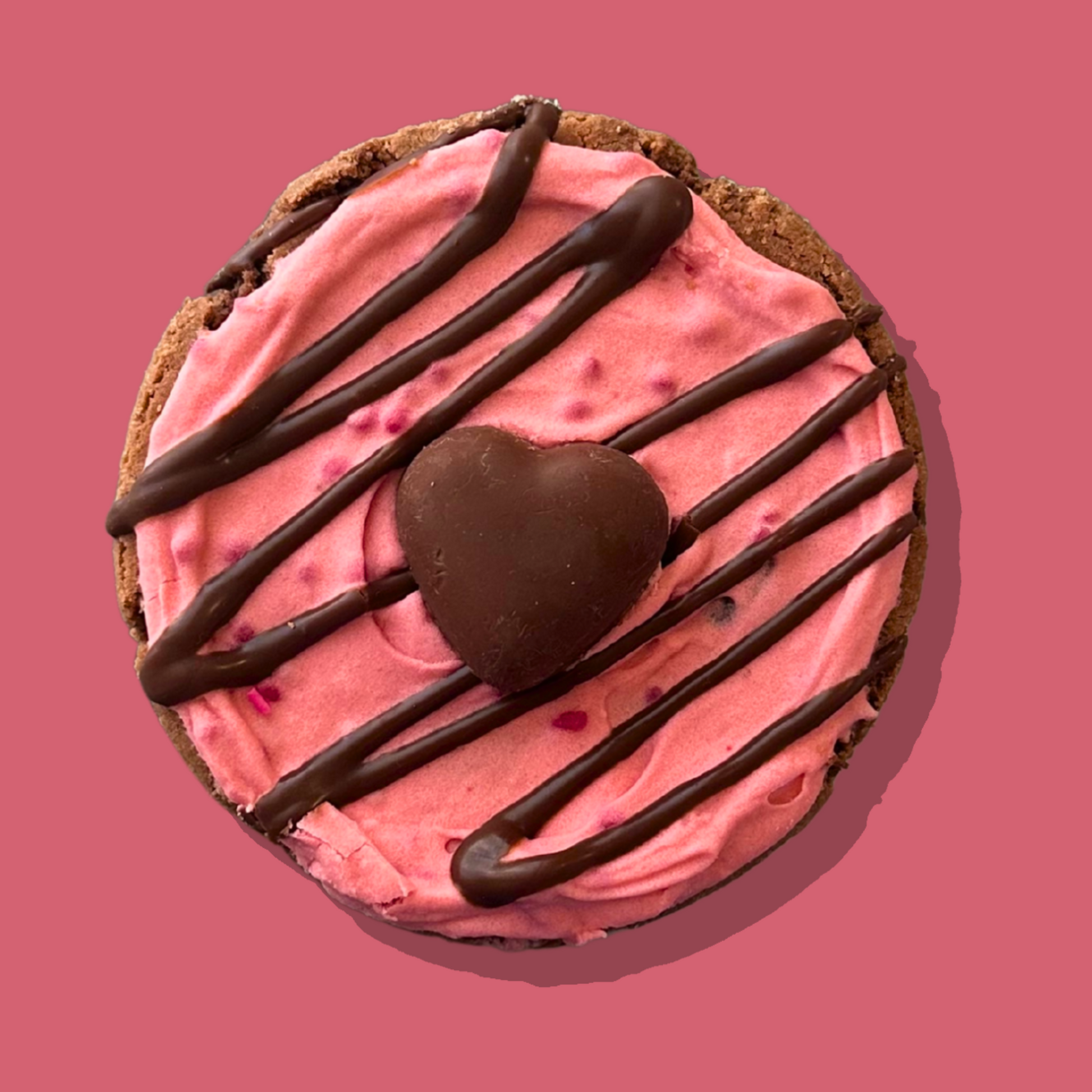 Dark Desire Maxi cookie with raspberry cream frosting and chocolate heart.