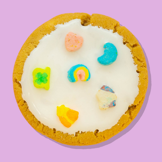 Lucky Charms Maxi cookie topped with white chocolate and colorful marshmallow shapes.