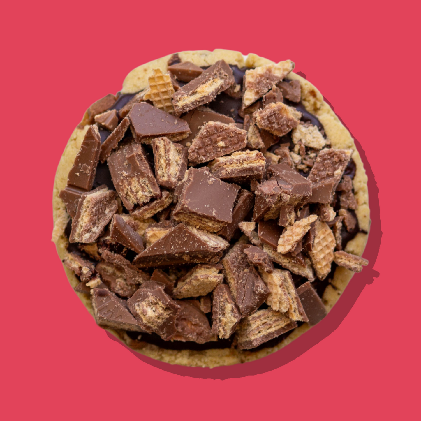KitKat Maxi cookie topped with chopped KitKat pieces over chocolate ganache.