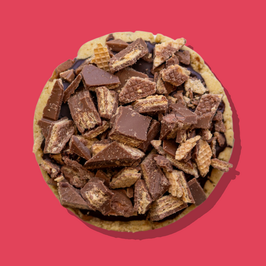 KitKat Maxi cookie topped with chopped KitKat pieces over chocolate ganache.