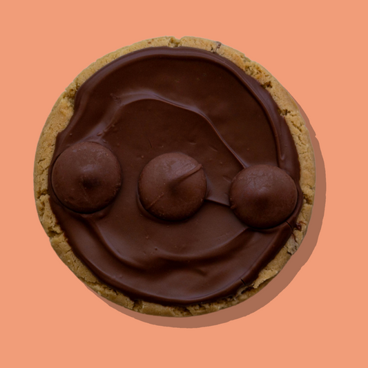 Chocolate hazelnut Nutella cookie with milk chocolate buttons on top.