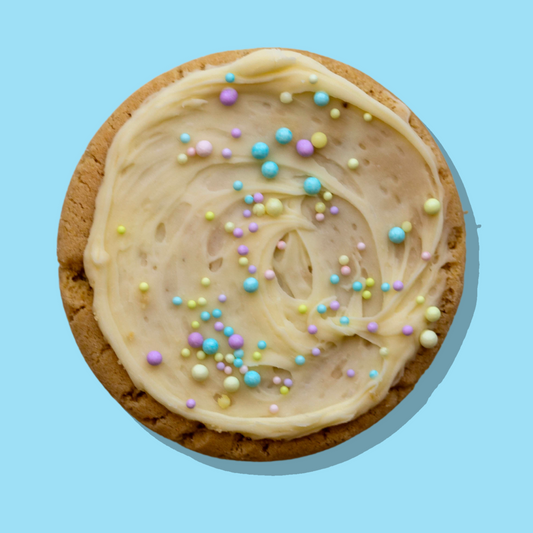 Cloud 9 Maxi cookie with vanilla frosting and pastel sprinkles on a white chocolate chip base.