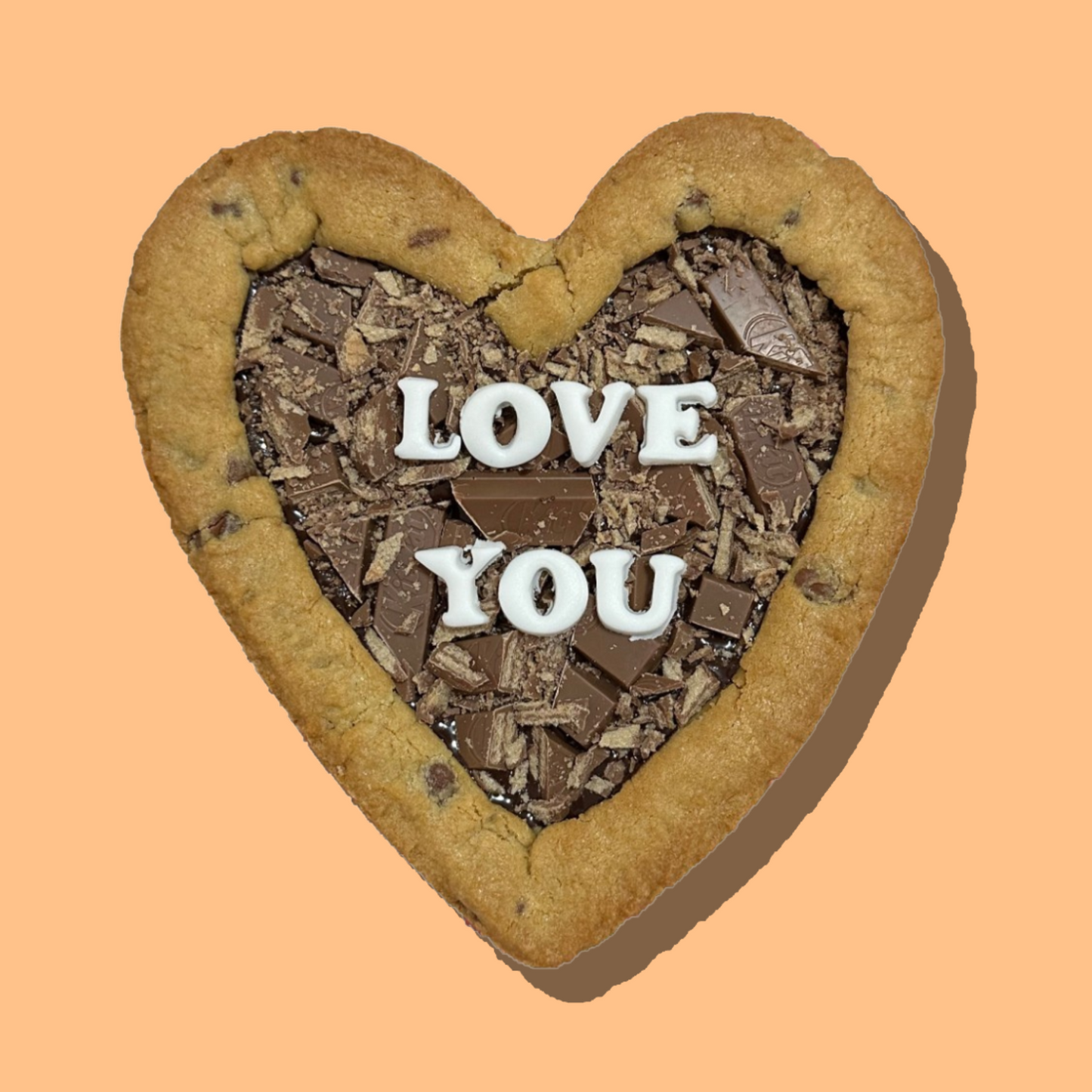 heart-shaped customisable cookie pie with chocolate and "love you" message